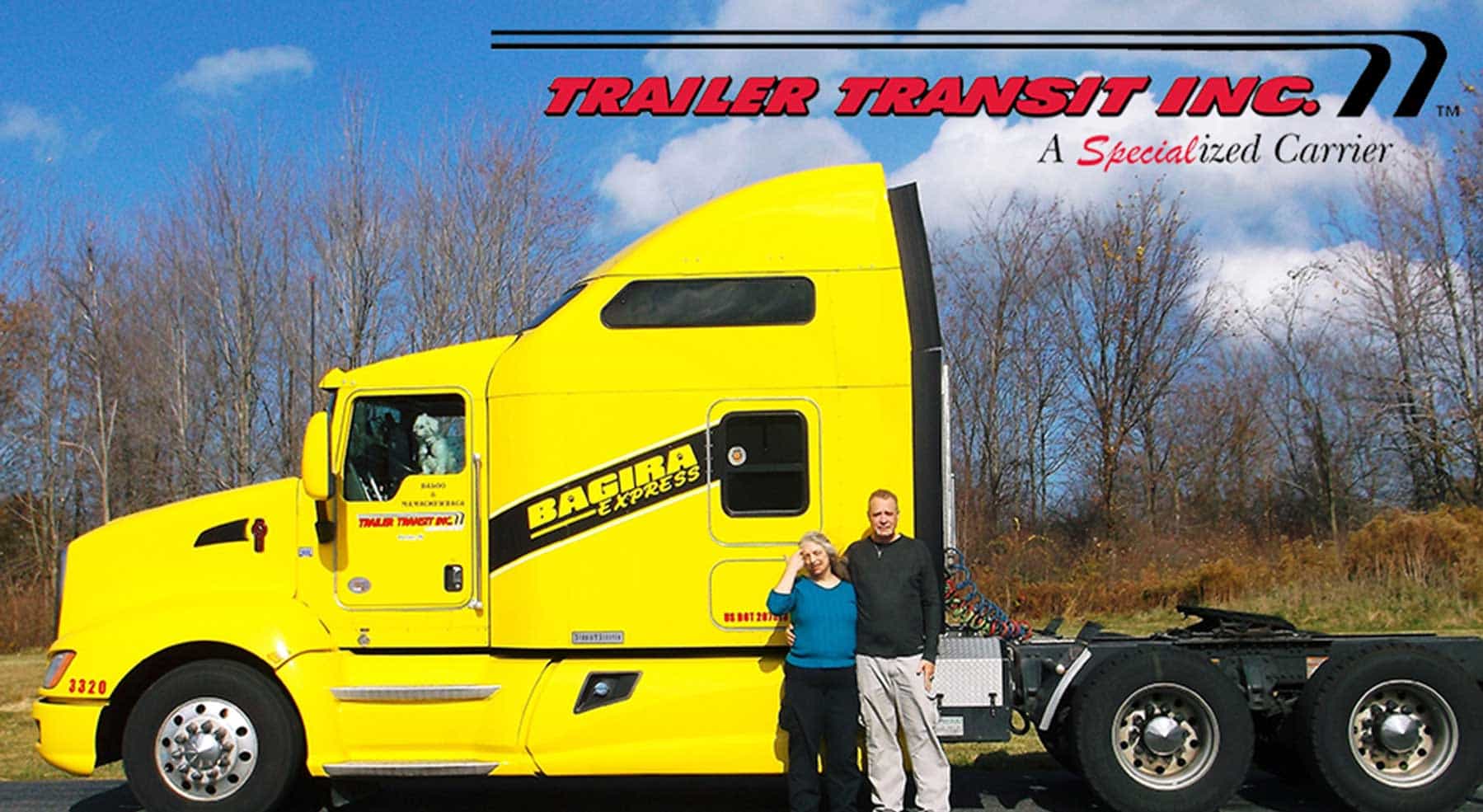 Trailer Transit Inc. | A man and woman standing in front of a yellow semi truck in April 2018.