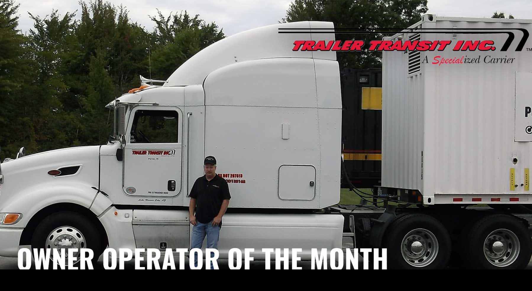 Trailer Transit Inc. | A man standing in front of a semi truck with the words owner operator of the month.