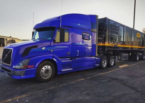 Trailer Transit Inc. blue truck with black trailer
