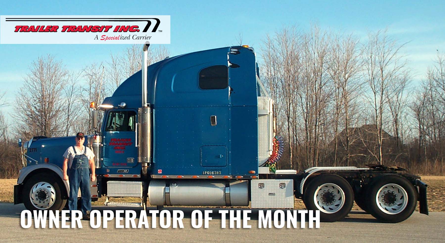 Trailer Transit Inc. | A man standing in front of a semi truck with the words owner operator of the month.