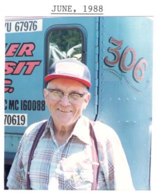 Harold smiling in front of a Trailer Transit Inc. truck