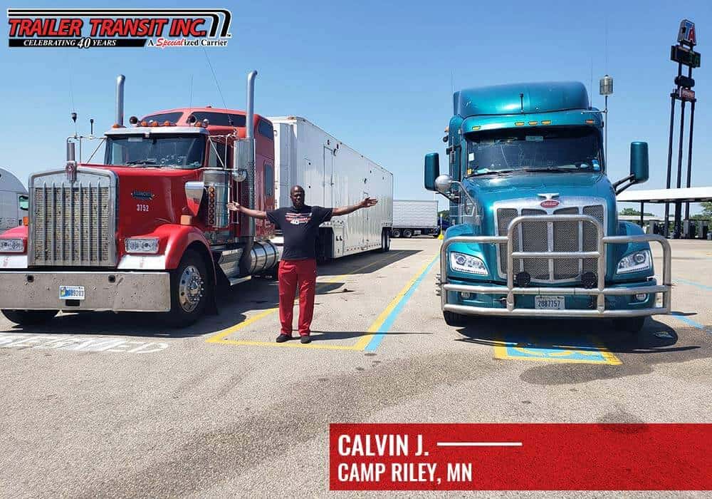 Owner Operator Calvin J. standing in front of his big rig