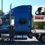 Trailer Transit Inc. | A man (owner operator) standing in front of a semi truck.