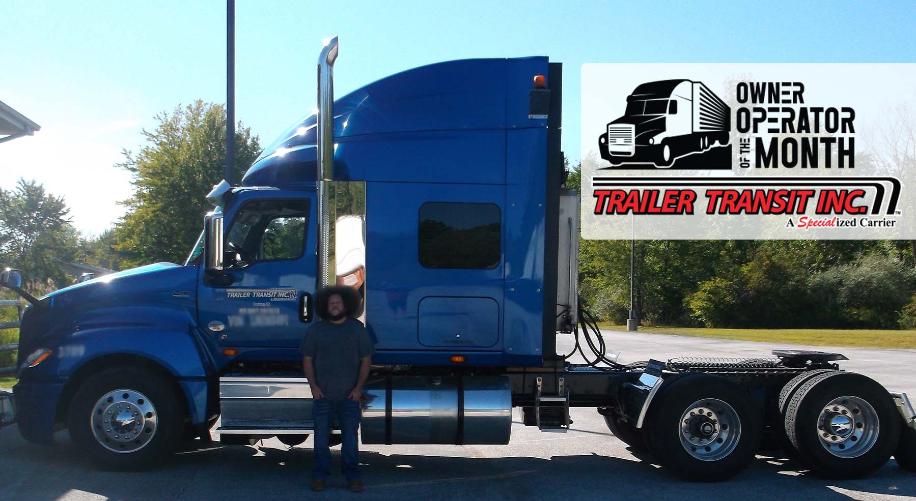 Trailer Transit Inc. | A man (owner operator) standing in front of a semi truck.
