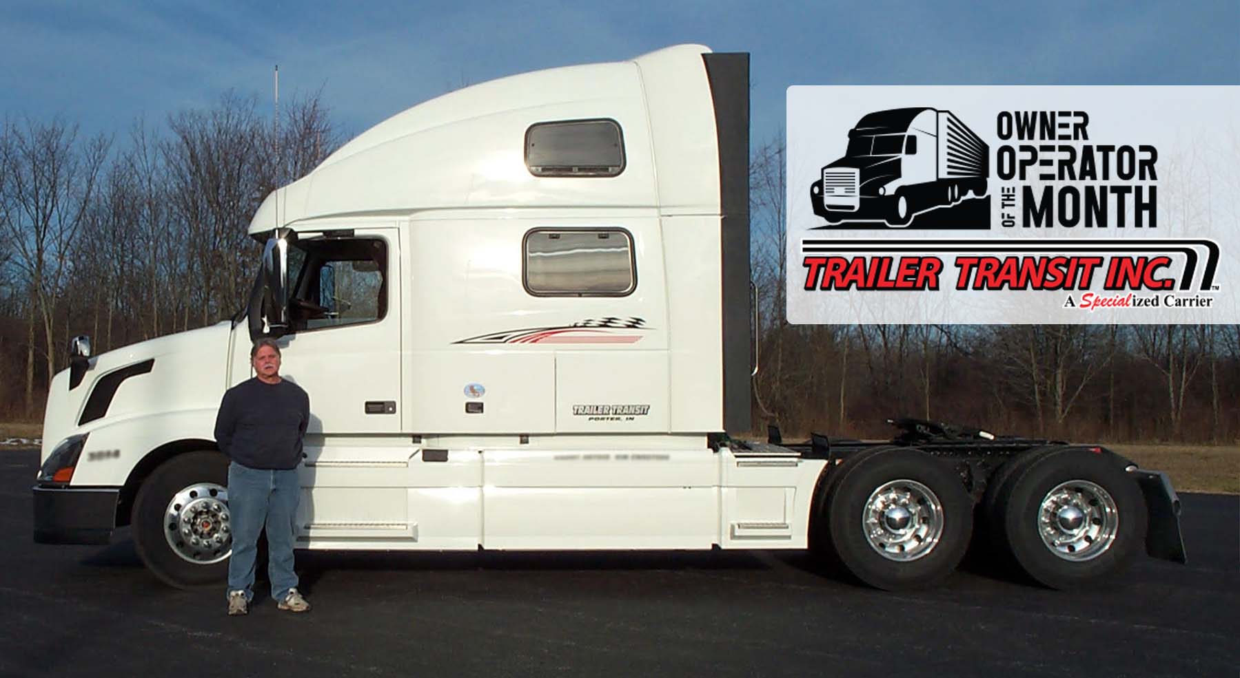 Trailer Transit Inc. | A man standing in front of a semi truck.