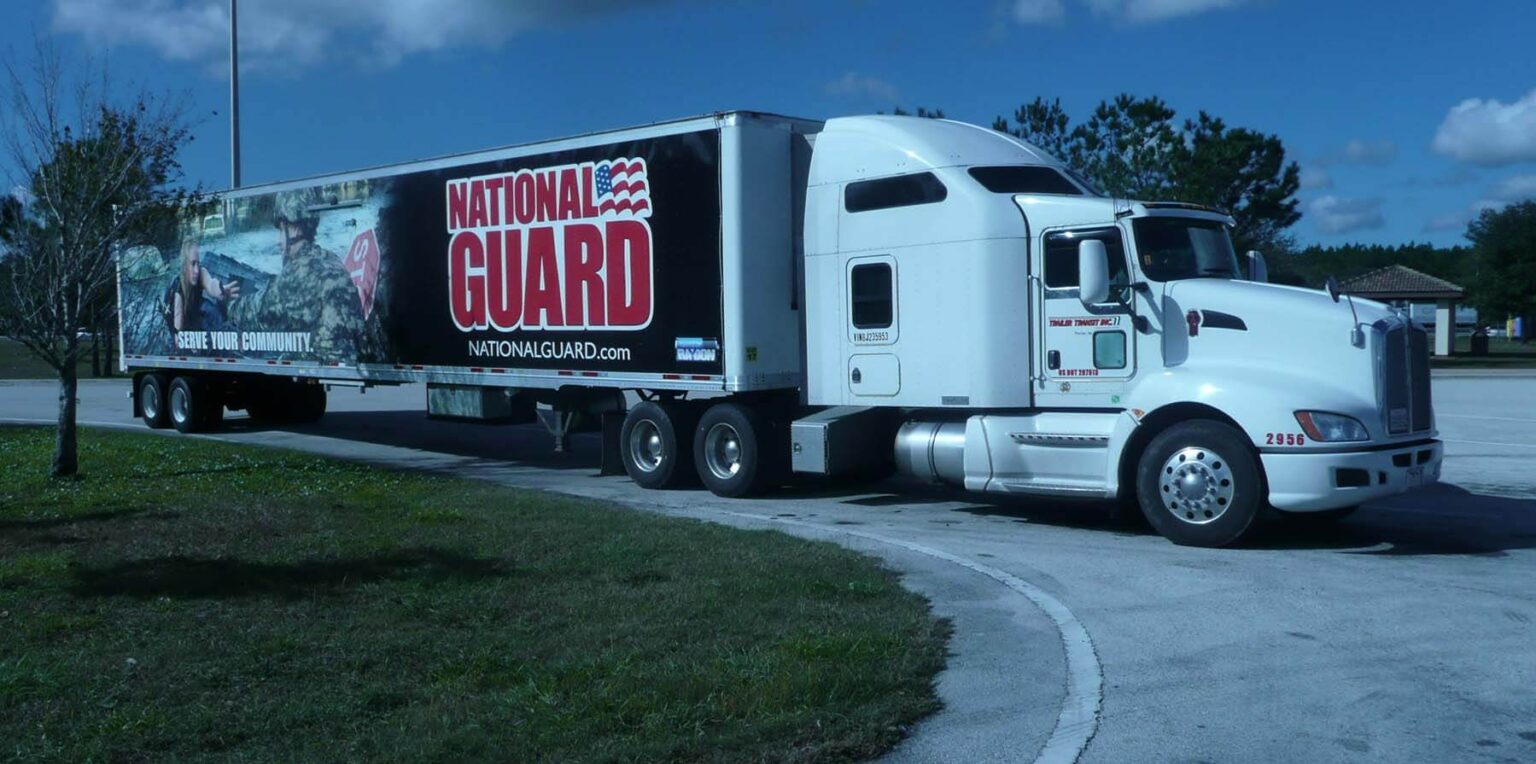 Trailer Transit, Inc truck hauling for the National Guard