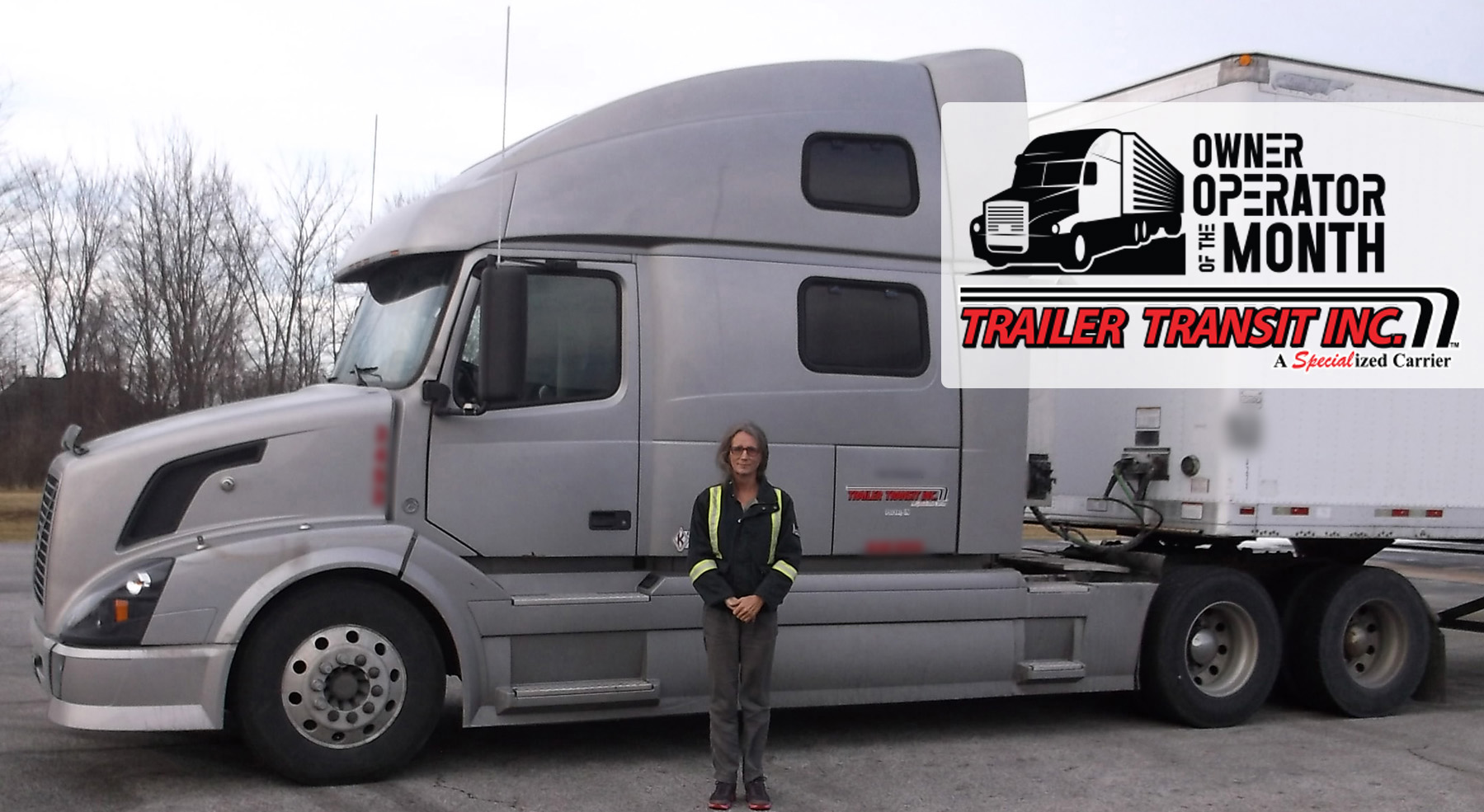 Trailer Transit Inc. | A woman standing in front of a silver semi truck.