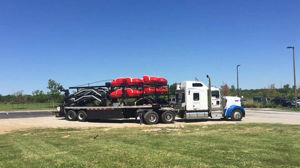 Trailer Transit, Inc truck hauling a carnival ride.