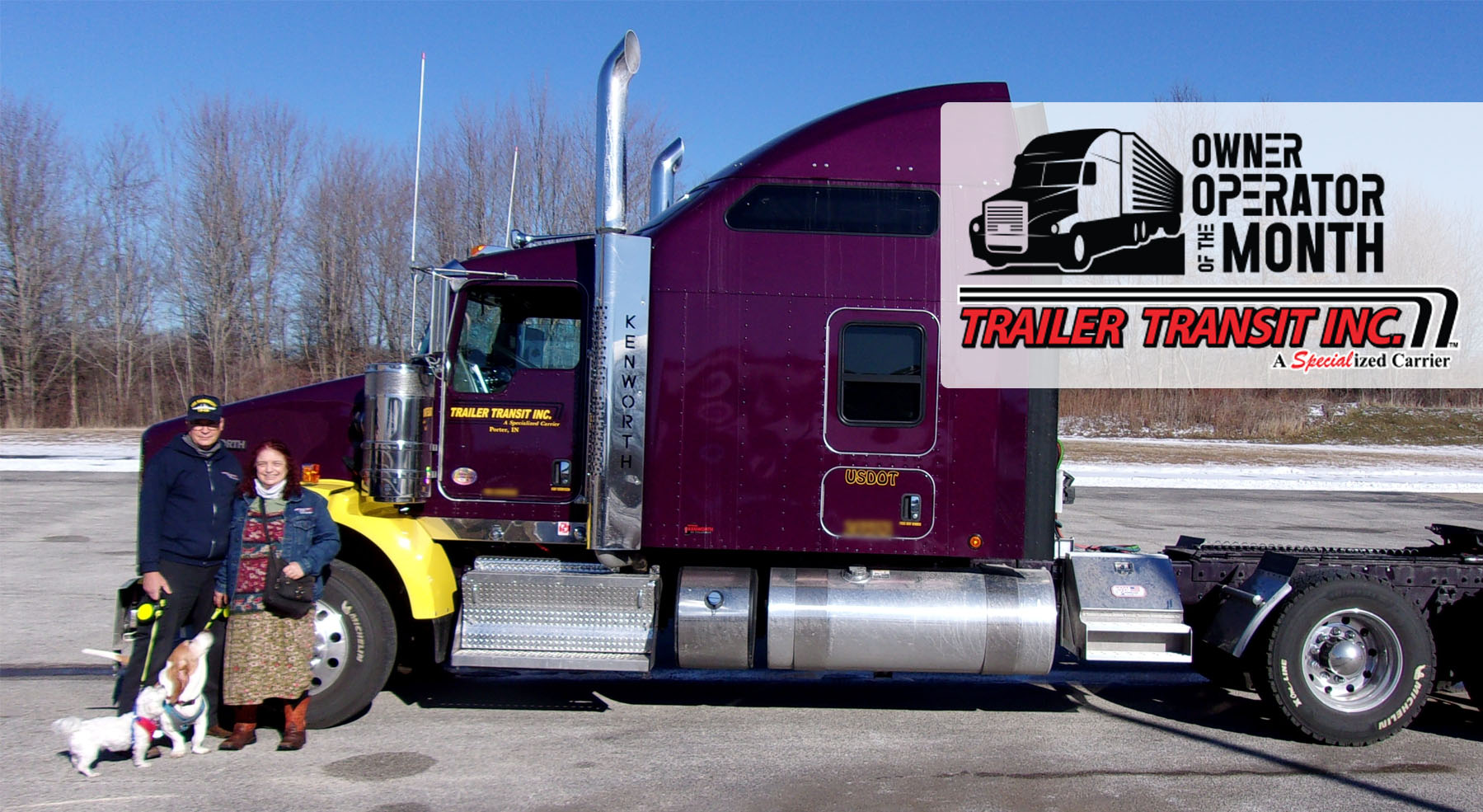 Trailer Transit Inc. | Two people standing next to a purple semi truck.