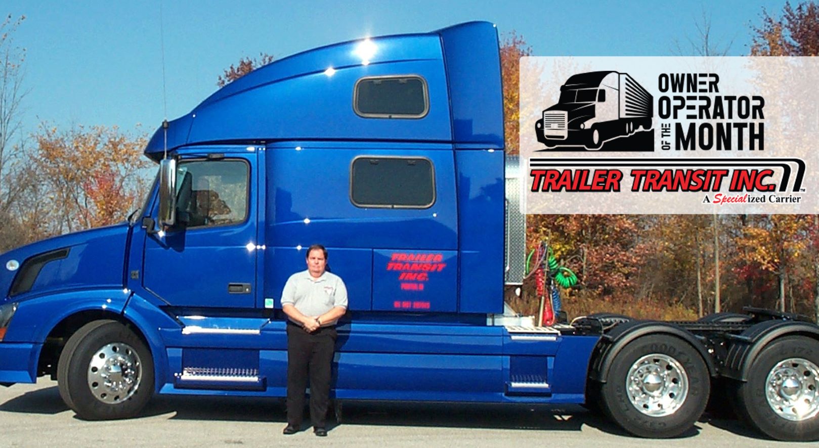 Trailer Transit Inc. | A man standing in front of a blue semi truck.