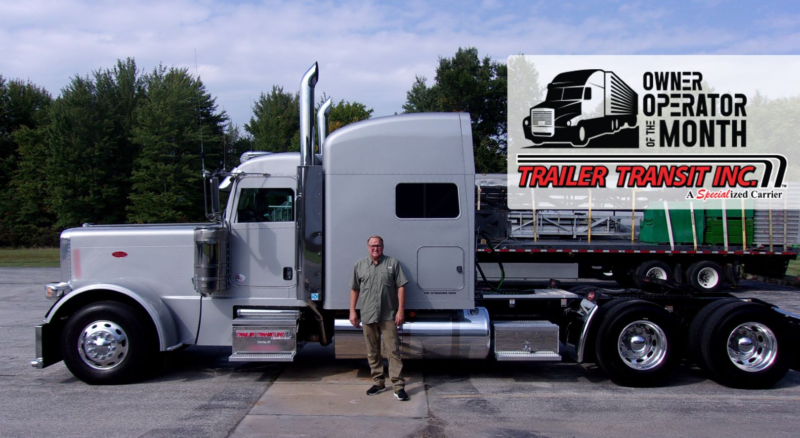 Trailer Transit Inc. | A man standing in front of a truck.