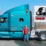 Trailer Transit Inc. | A man standing in front of a blue semi truck.