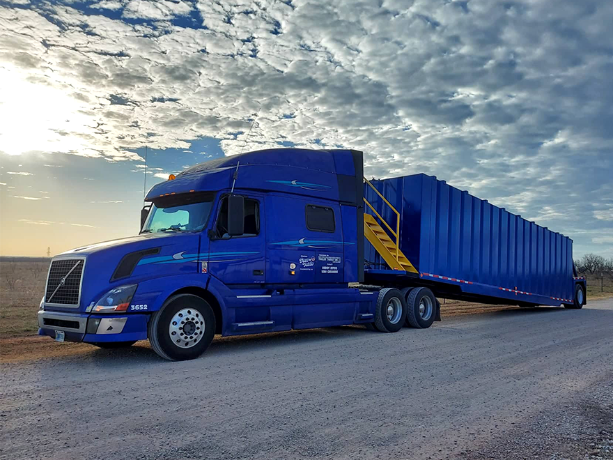 TT-BlogImage-0423-ArticleImages-2 Blue truck and trailer against beautiful cloudy sky near dusk