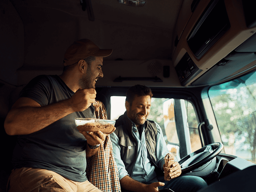 Trailer Transit Inc. | Two men, belonging to one of the Owner Operator Transport Companies, sitting in the driver's seat of a truck.