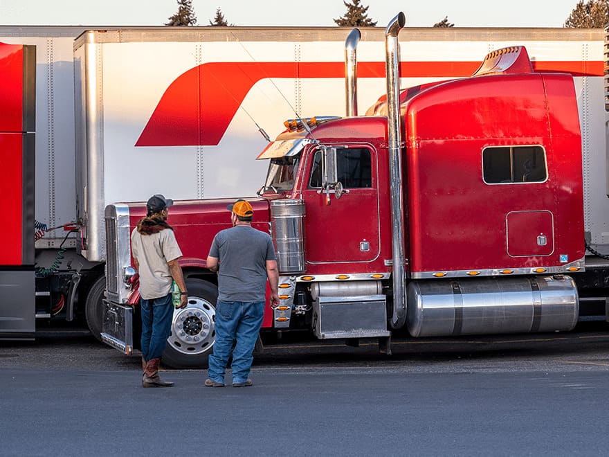 TT-BlogImage-0523-ArticleImages6 Trailer Transit Inc. | A red semi truck owned by a transport company.