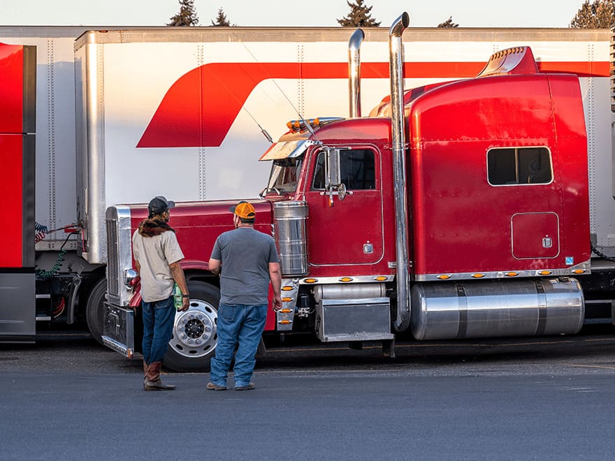 Trailer Transit Inc. | A red semi truck owned by a transport company.