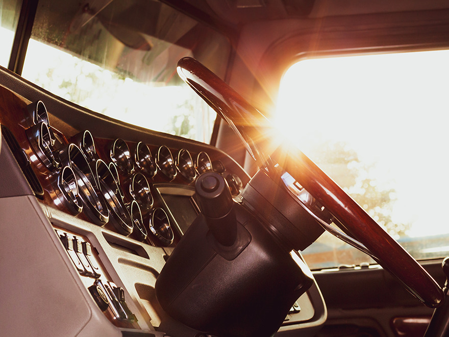 sun shining through truck window showing the steering wheel and dashboard