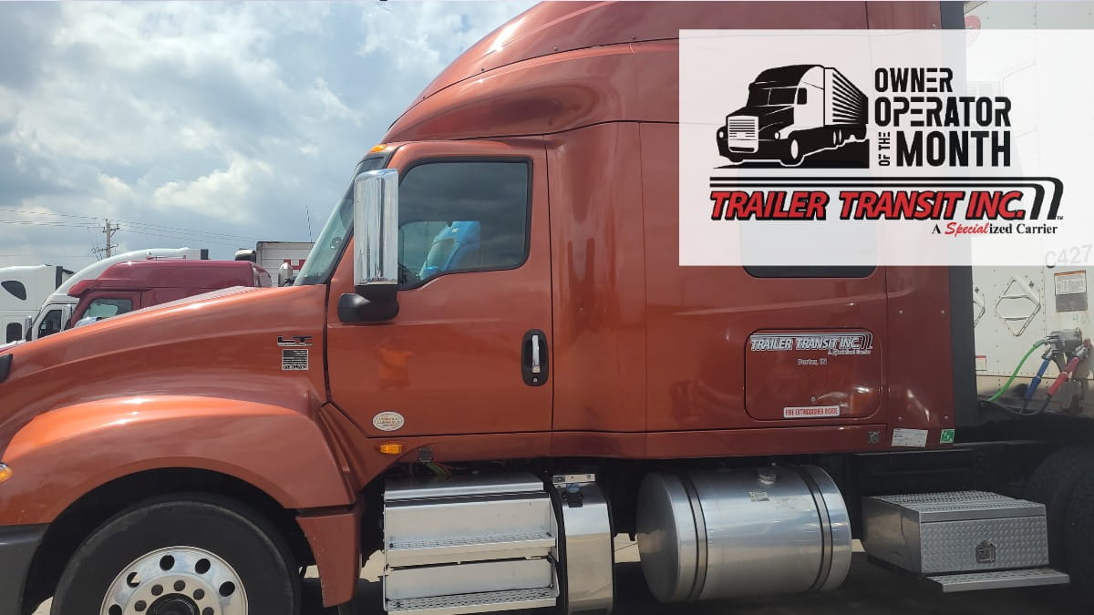 Trailer Transit Inc. | The Owner Operator of the Month's semi truck is parked in a parking lot.