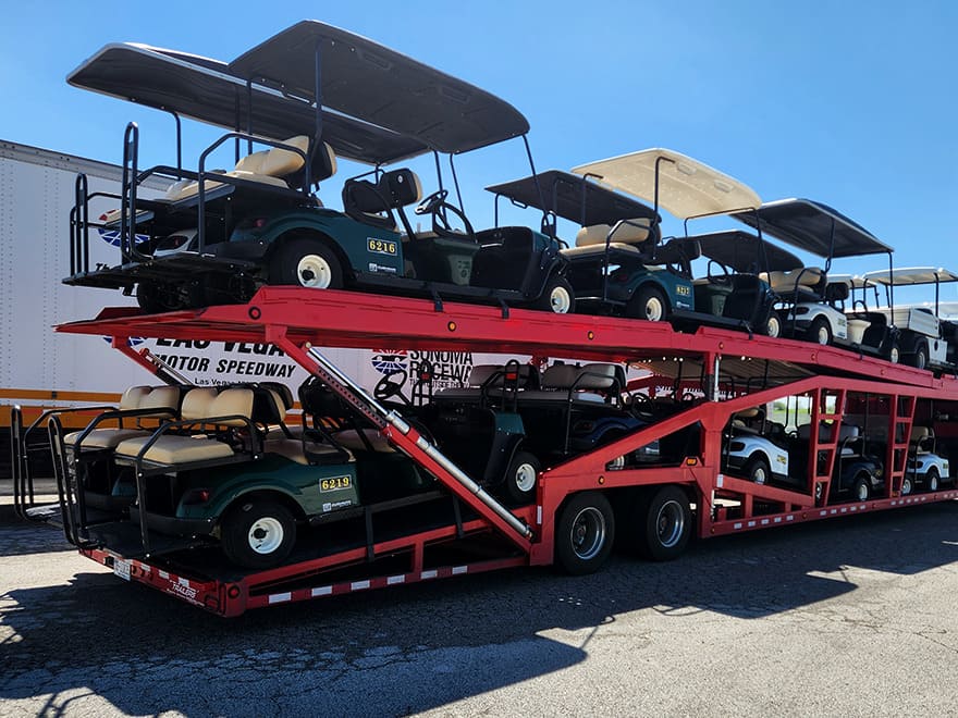 trailer hauling new golf carts