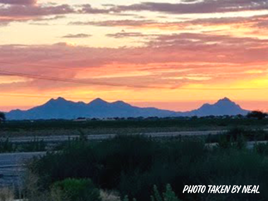 Trailer Transit Inc. | A breathtaking sunset illuminating majestic mountains in the background.