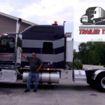 Trailer Transit Inc. | Owner Operator of the Month, Mike, standing in front of his semi truck.
