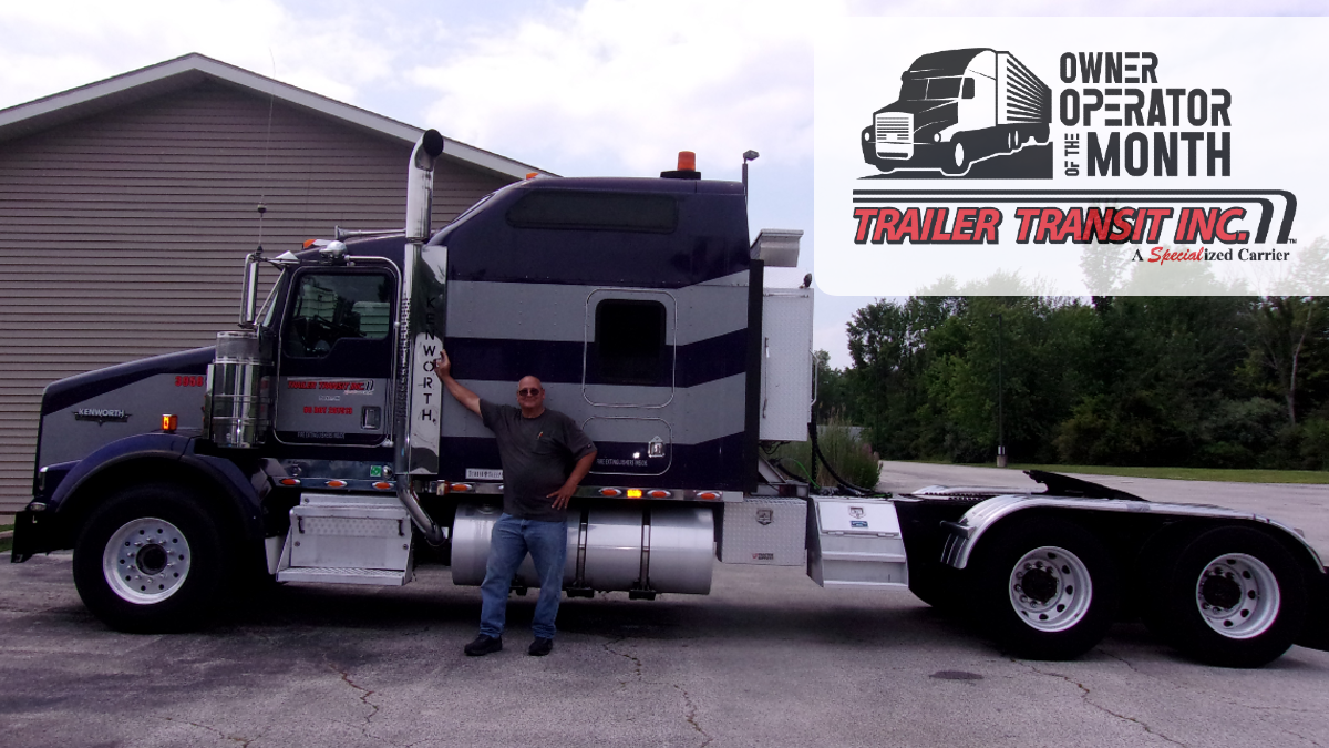 Trailer Transit Inc. | Owner Operator of the Month, Mike, standing in front of his semi truck.
