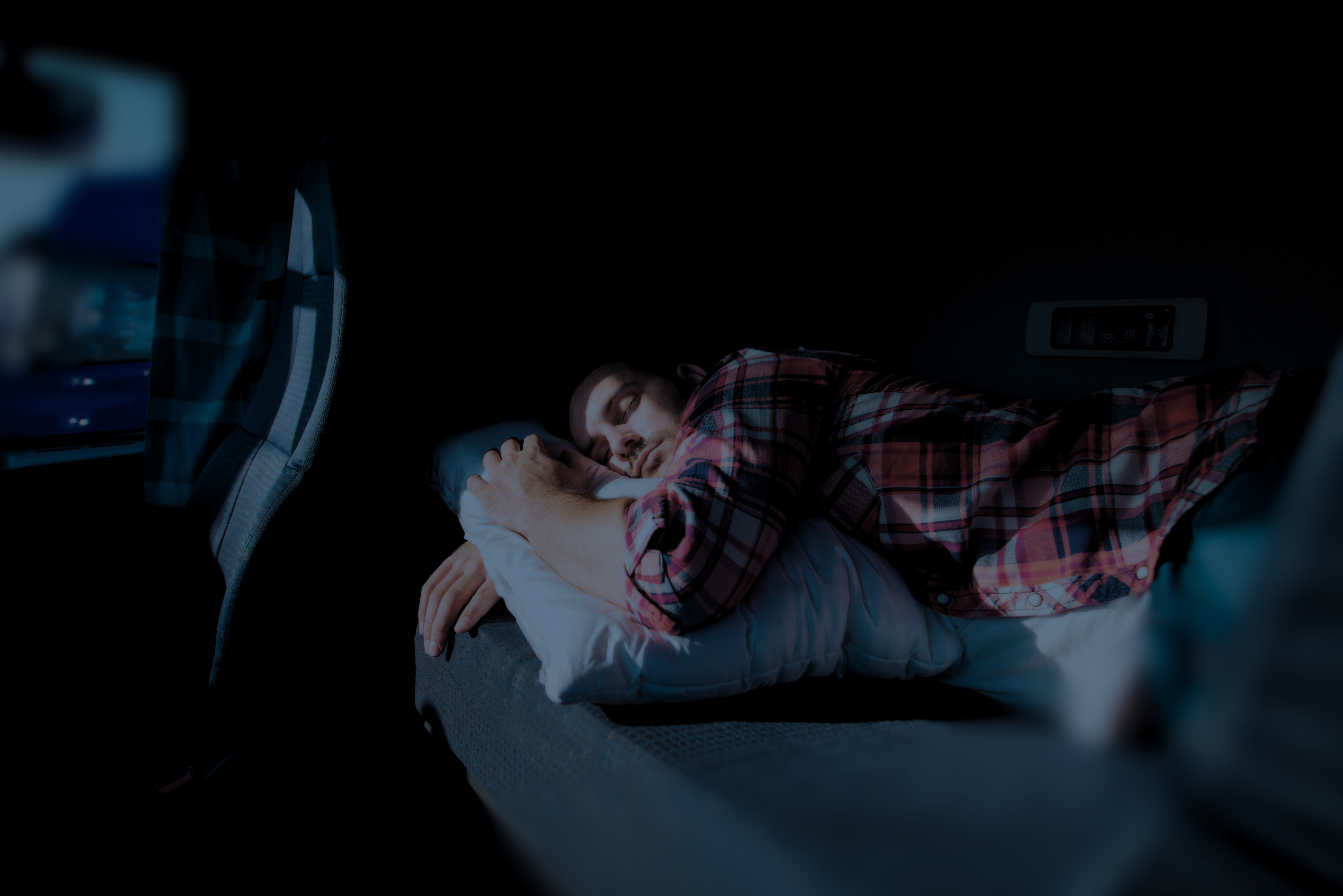 2 Trailer Transit, Inc | truck driver sleeping in a sleeper cab