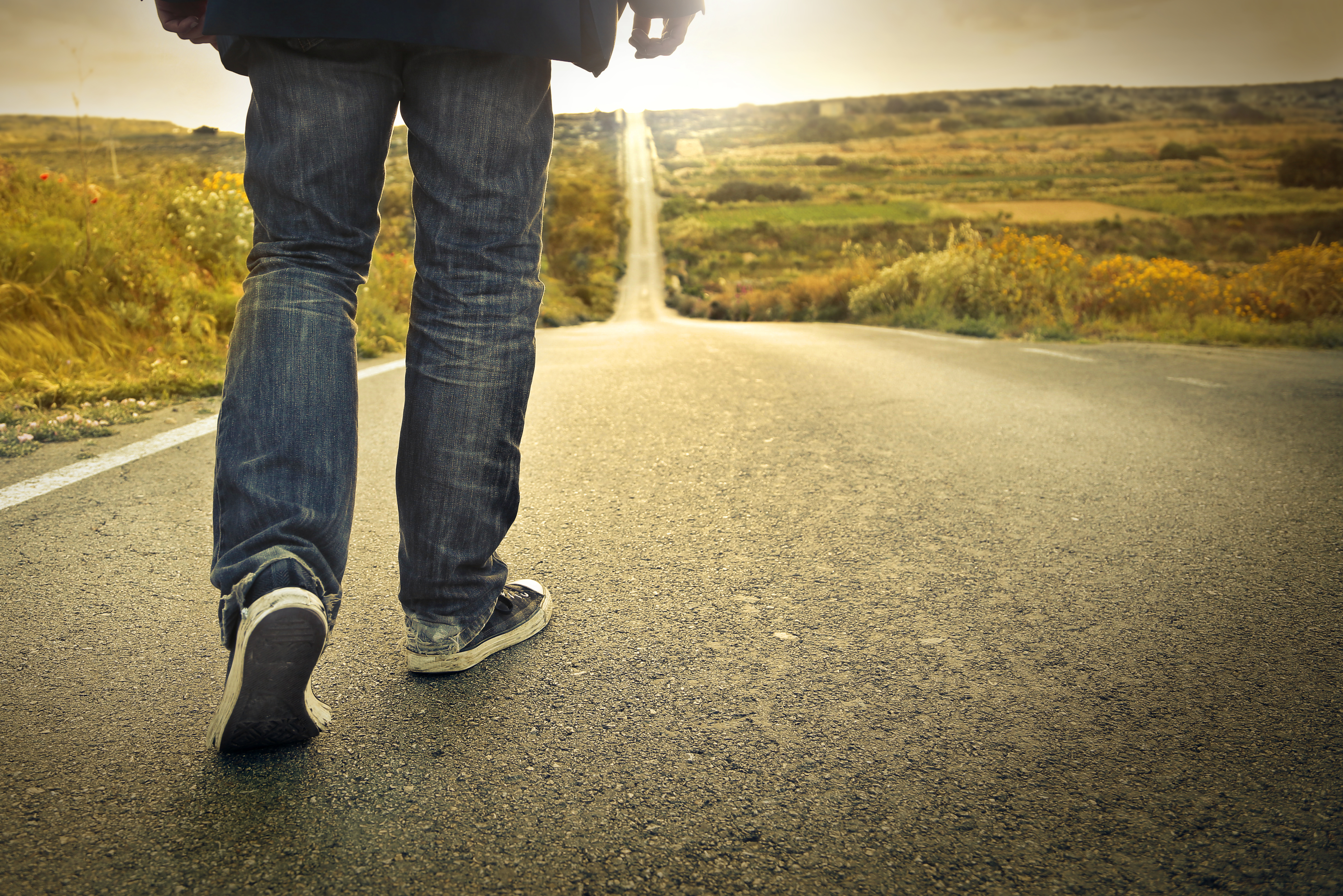 4 Trailer Transit, Inc | man walking down a long road into the sunset