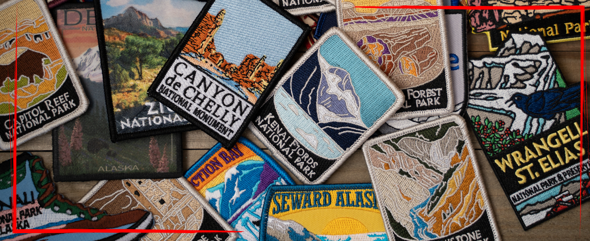 Trailer Transit Inc. | A collection of colorful embroidered national park and national monument patches - some landmarks that are favorite stops for power only drivers.