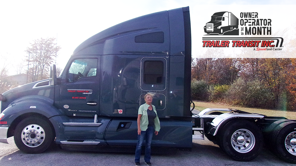 Trailer Transit Inc. | Owner Operator Brenda stands in front of her semi-truck. A logo in the top right corner reads "Owner Operator of the Month, Trailer Transit Inc," celebrating outstanding Owner Operator achievements.