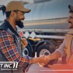 Trailer Transit Inc. | A power only driver and workman holding a clipboard shake hands near a tanker truck. Showcasing owner operators getting their shipments to destinations on time. "Trailer Transit Inc." logo appears in the lower corner.
