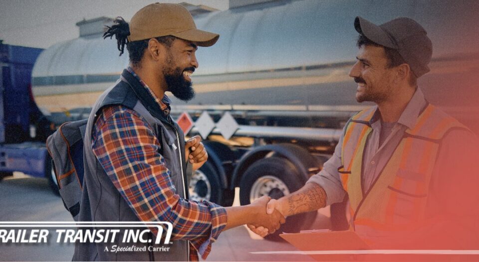 Trailer Transit Inc. | A power only driver and workman holding a clipboard shake hands near a tanker truck. Showcasing owner operators getting their shipments to destinations on time. "Trailer Transit Inc." logo appears in the lower corner.