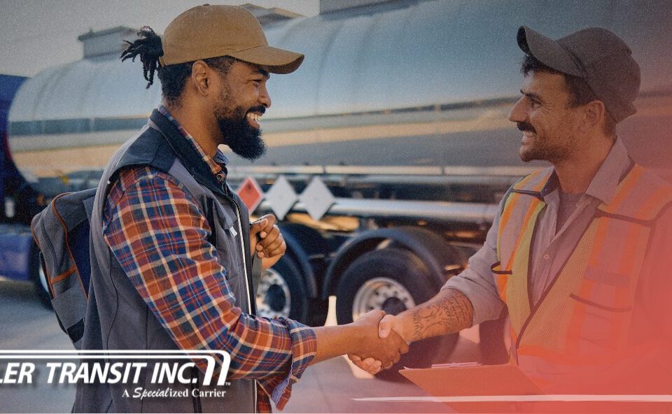 Trailer Transit Inc. | A power only driver and workman holding a clipboard shake hands near a tanker truck. Showcasing owner operators getting their shipments to destinations on time. "Trailer Transit Inc." logo appears in the lower corner.