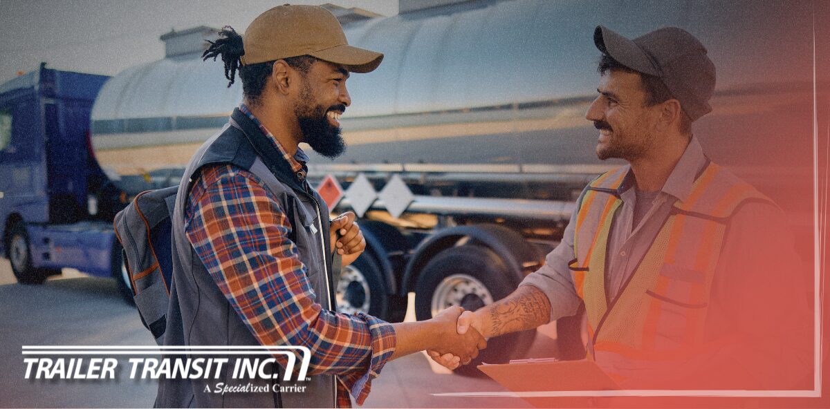 Trailer Transit Inc. | A power only driver and workman holding a clipboard shake hands near a tanker truck. Showcasing owner operators getting their shipments to destinations on time. "Trailer Transit Inc." logo appears in the lower corner.