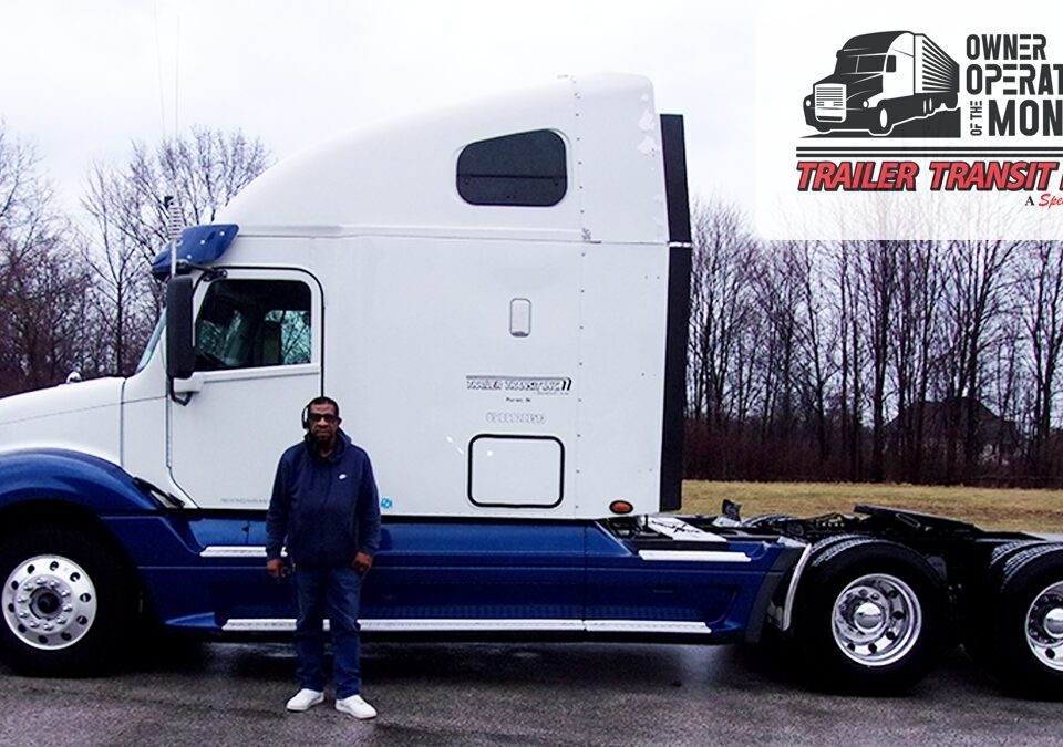 Trailer Transit Inc. | Owner Operator, Nathaniel, stands in front of his blue and white semi-truck, representing Owner Operator trucking in Indiana. The image features "Owner Operator of the Month" and "Trailer Transit Inc." logos in the corner.