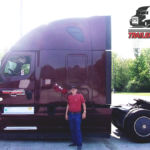 Trailer Transit, Inc. | Owner Operator, Allen, wearing a red shirt stands in front of a maroon semi-truck. “Owner Operator of the Month” and “Trailer Transit Inc.” logos appear in the top right corner.